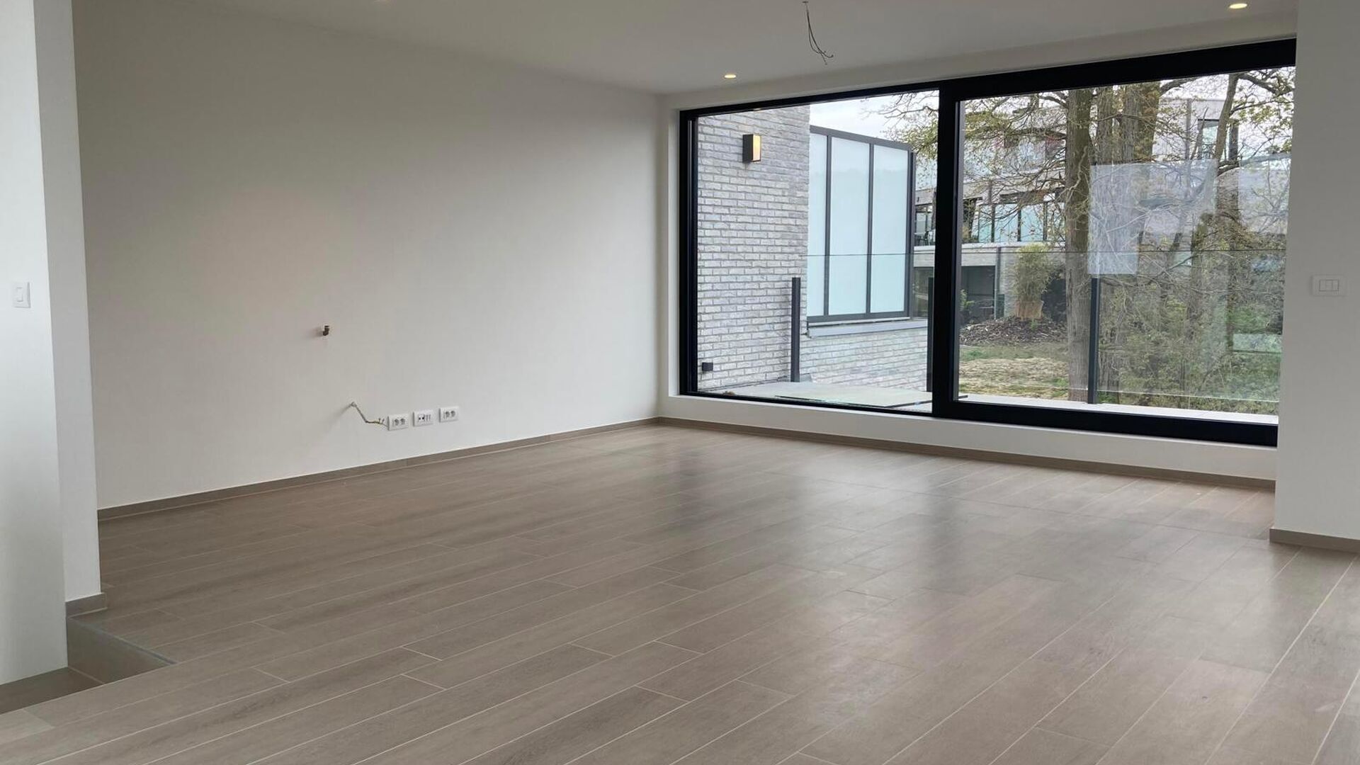 This small-scale luxury residence houses 8 apartments, including this duplex penthouse on the first and second floors. The apartment comprises an entrance hall (elevator goes up to the apartment) on the second floor with separate toilet, open installed ki