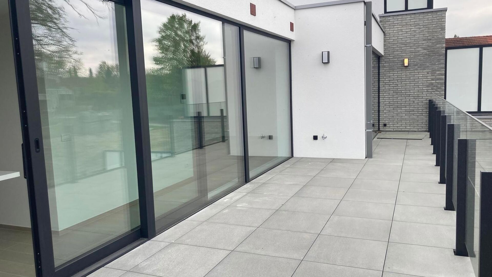 This small-scale luxury residence houses 8 apartments, including this duplex penthouse on the first and second floors. The apartment comprises an entrance hall (elevator goes up to the apartment) on the second floor with separate toilet, open installed ki