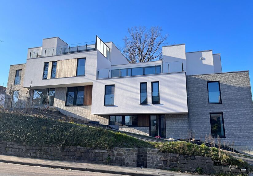 This small-scale luxury residence houses 8 apartments, including this duplex penthouse on the first and second floors. The apartment comprises an entrance hall (elevator goes up to the apartment) on the second floor with separate toilet, open installed ki